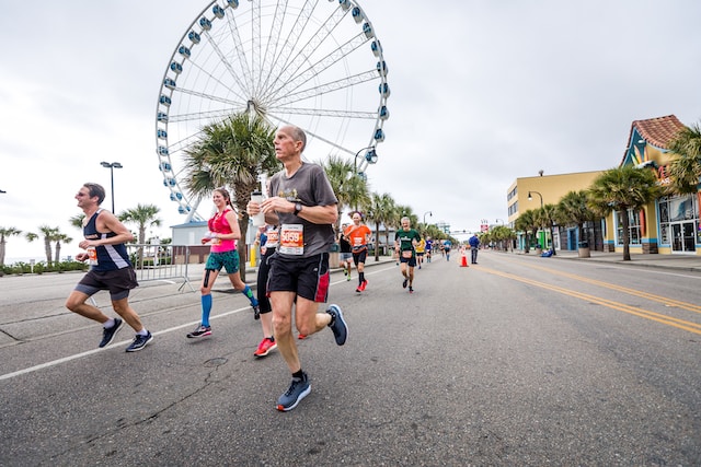Old man running at a marathon